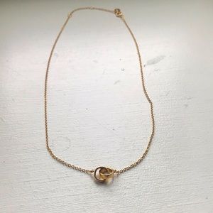 Gold necklace with linked charm